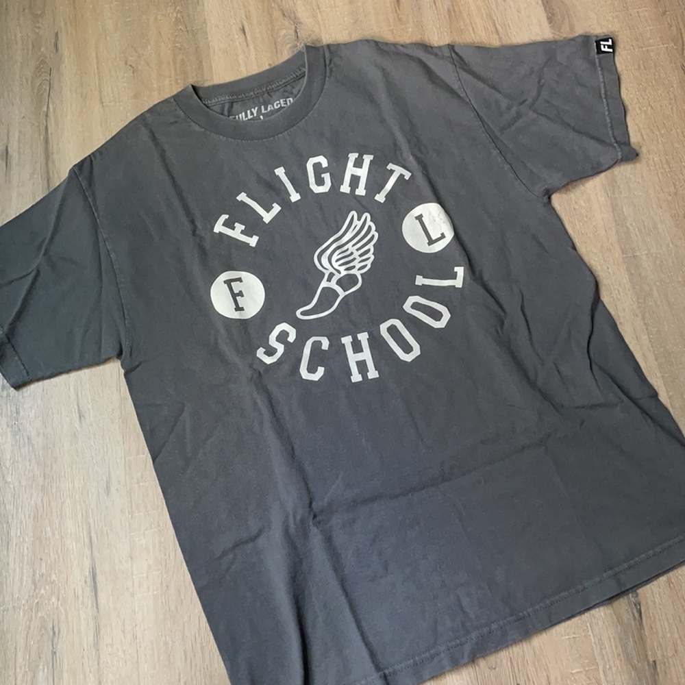 Fully Laced Flight School tee.